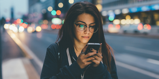 Young woman checking her phone for more gig work